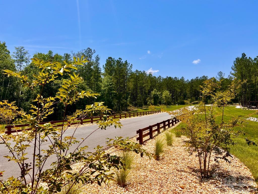Lot 16 Naturewalk Drive Milton, FL 32571 - Photo 30 of 35 a view of a swimming pool with an outdoor space and seating area