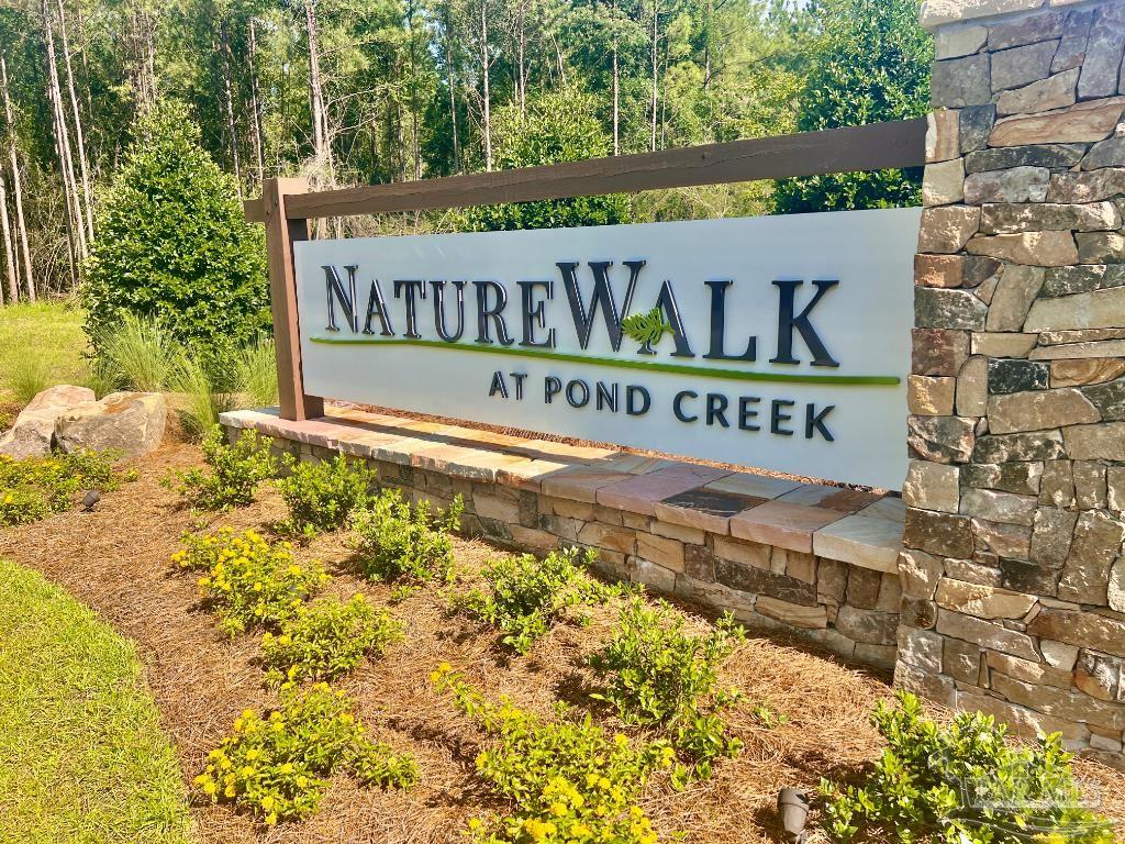 Lot 16 Naturewalk Drive Milton, FL 32571 - Photo 34 of 35 a sign on the side of building