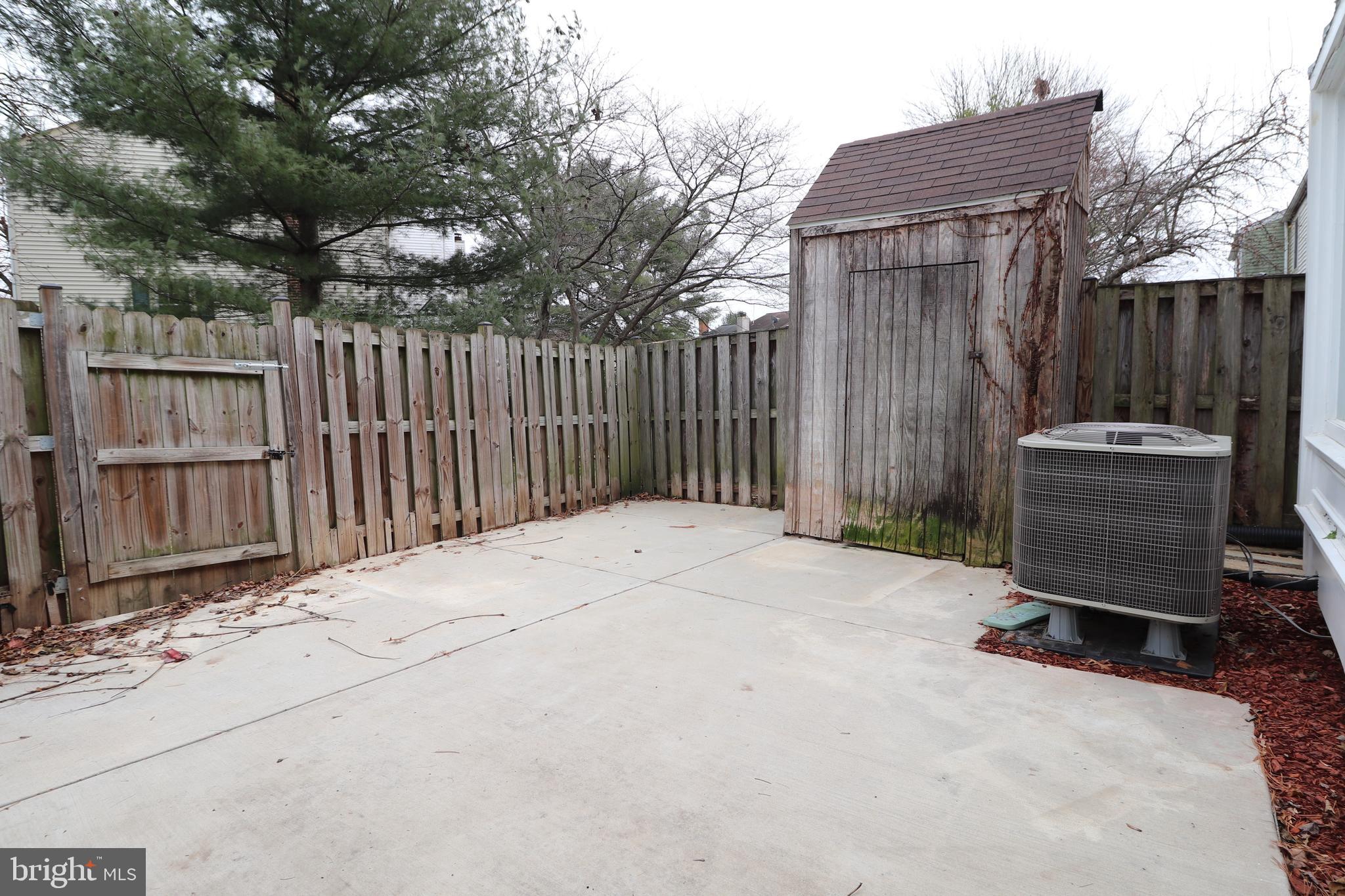 138 Sharpstead Lane Gaithersburg, MD 20878 - Photo 35 of 36 a backyard of a house with barbeque oven and trees