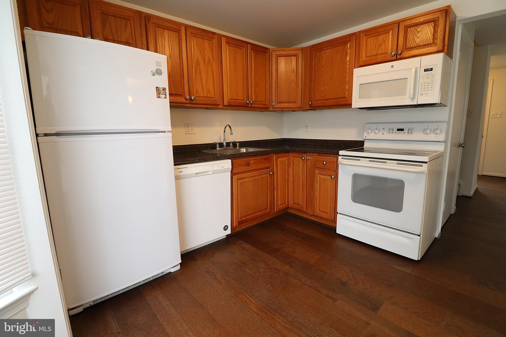 138 Sharpstead Lane Gaithersburg, MD 20878 - Photo 10 of 36 a kitchen with stainless steel appliances granite countertop a refrigerator sink and stove