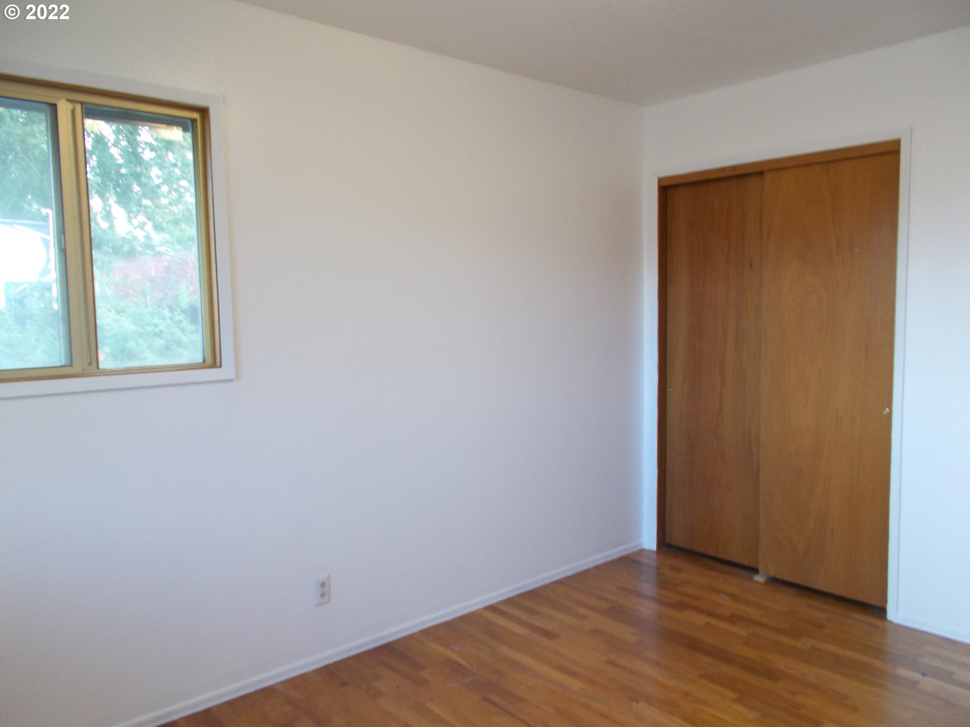 1388 Southwest 39th Street Pendleton, OR 97801 - Photo 14 of 22 an empty room with wooden floor and windows