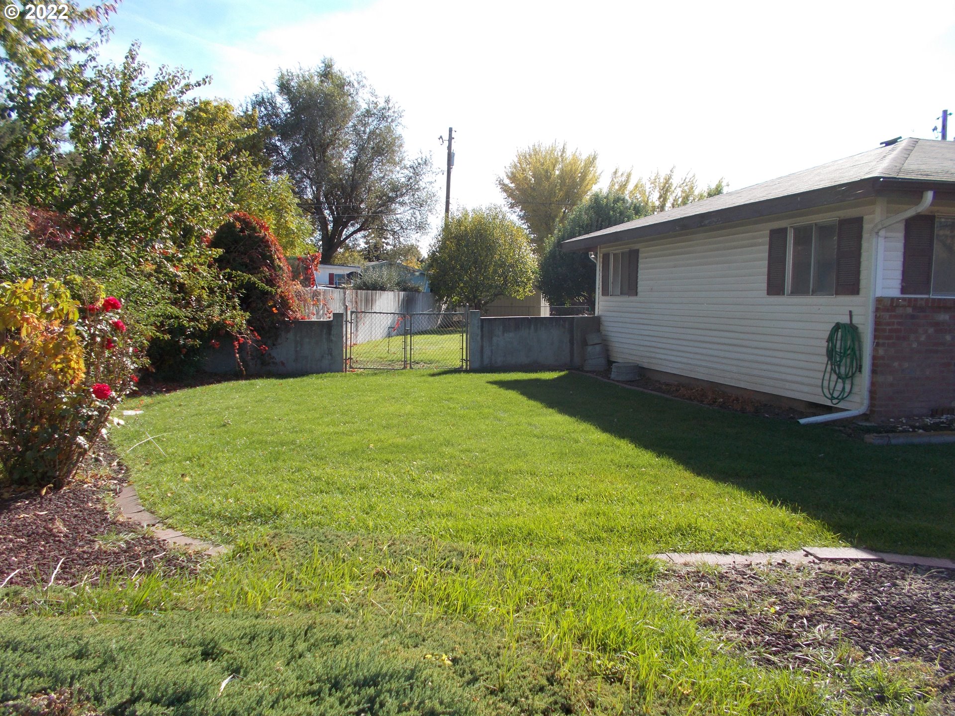 1388 Southwest 39th Street Pendleton, OR 97801 - Photo 18 of 22 a view of a backyard with a garden