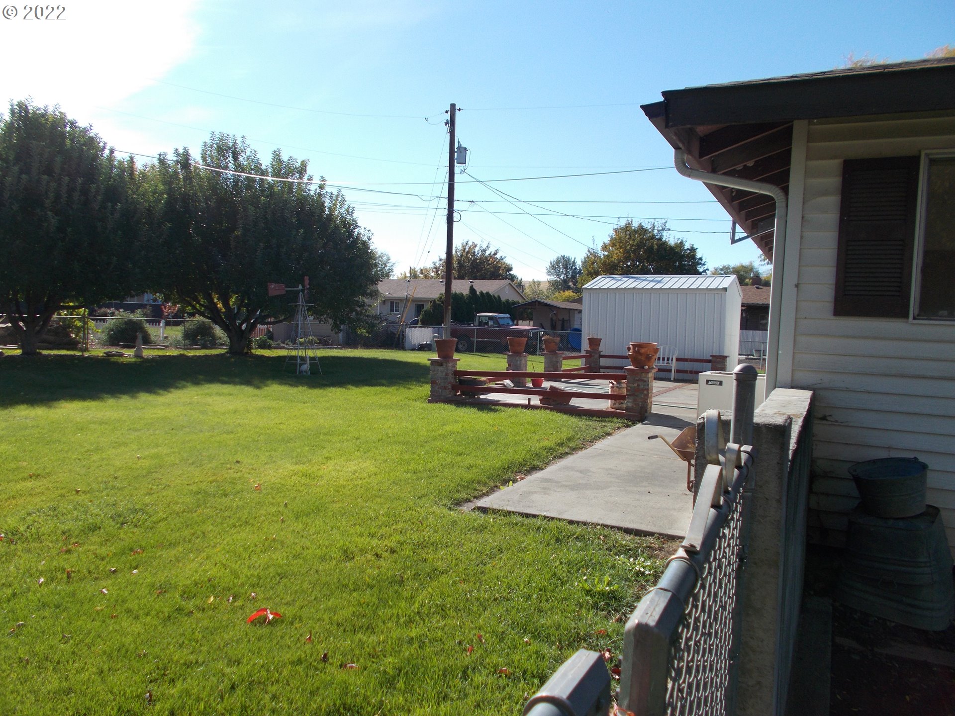 1388 Southwest 39th Street Pendleton, OR 97801 - Photo 20 of 22 a view of a backyard with couches plants and large trees