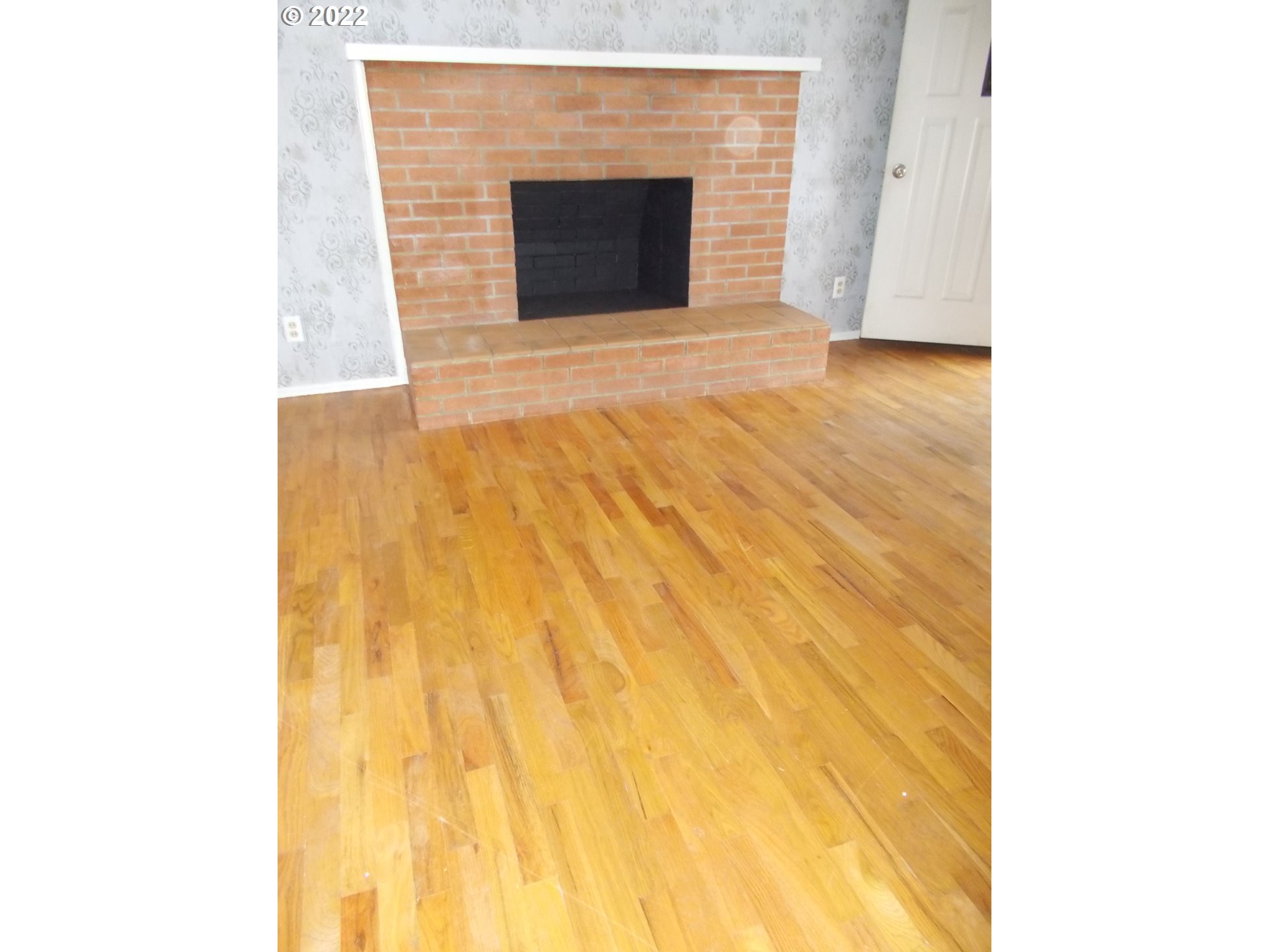 1388 Southwest 39th Street Pendleton, OR 97801 - Photo 4 of 22 a view of an empty room with wooden floor