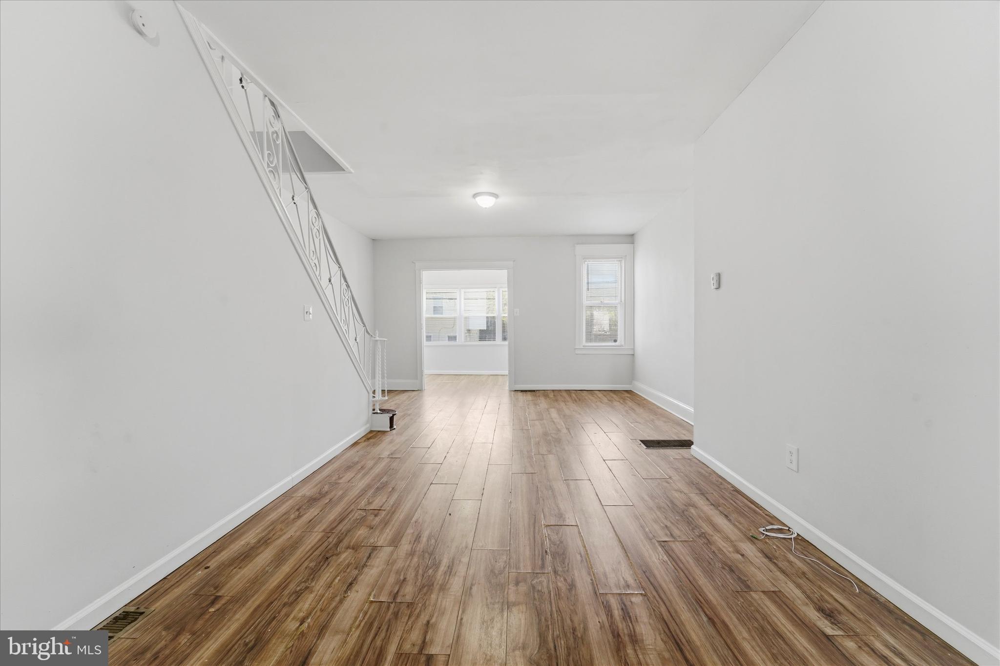 4009 Brown Street Philadelphia, PA 19104 - Photo 14 of 30 a view of wooden floor and windows in an empty room