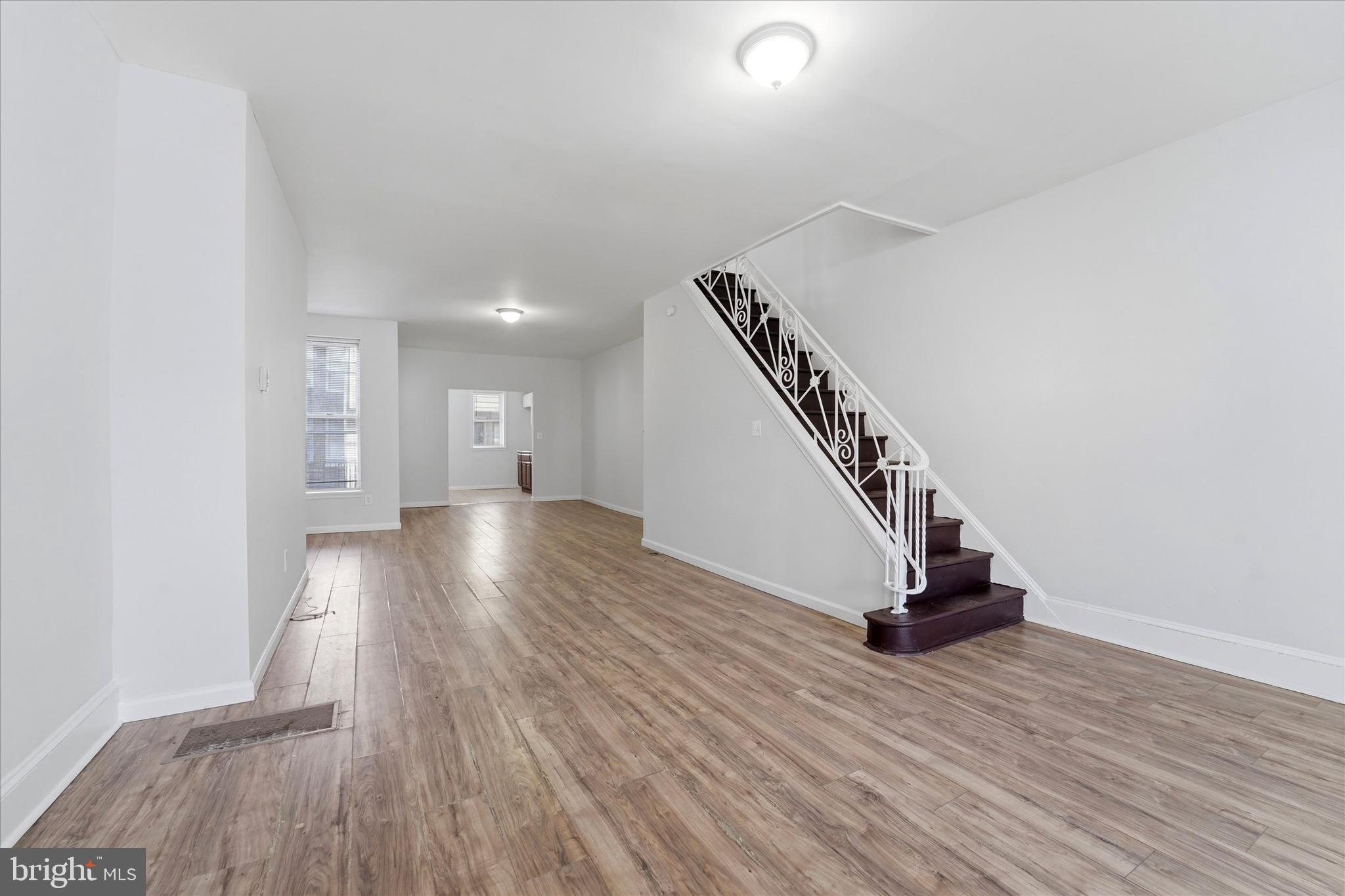 4009 Brown Street Philadelphia, PA 19104 - Photo 4 of 30 a view of a hallway with wooden floor and staircase