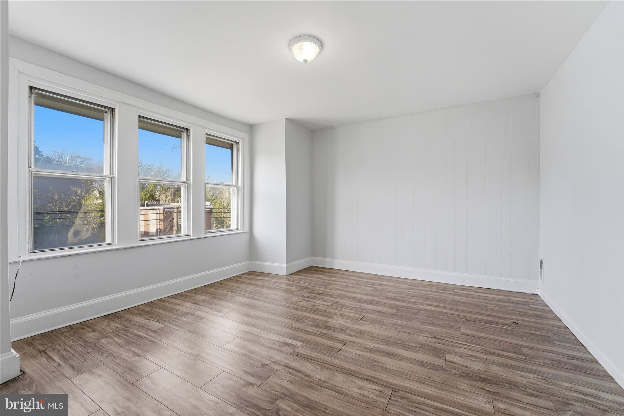 4009 Brown Street Philadelphia, PA 19104 - Photo 7 of 30 a view of an empty room with wooden floor and a window