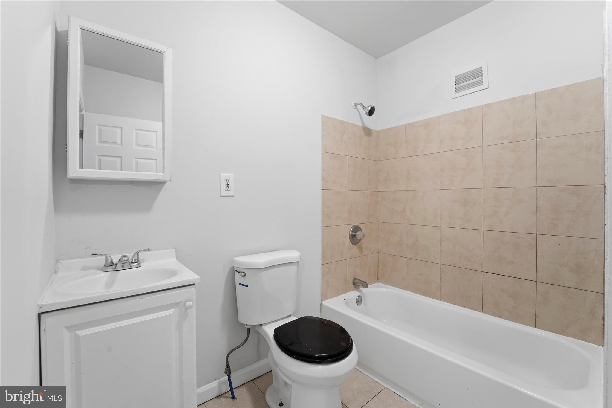 4009 Brown Street Philadelphia, PA 19104 - Photo 10 of 30 a bathroom with a sink a toilet and a bathtub
