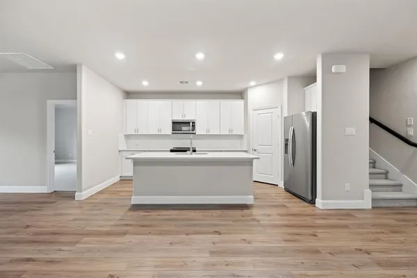 a view of kitchen with wooden floor