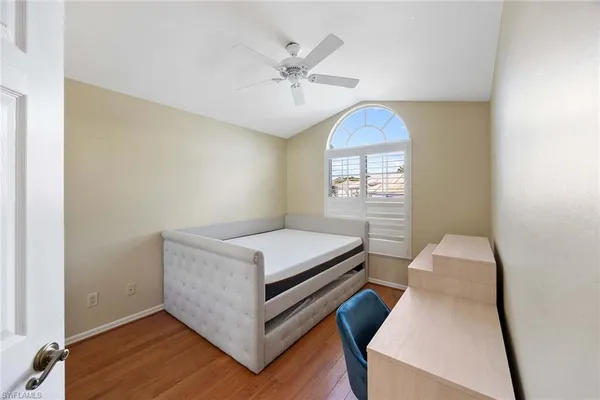 a room with a bed and a chandelier