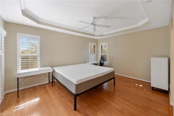 a room with pool table and windows