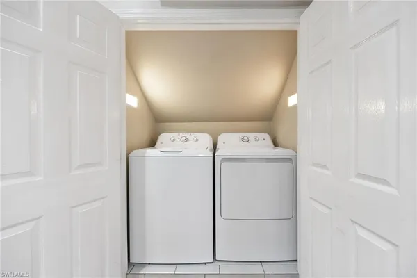 a utility room with dryer and washer
