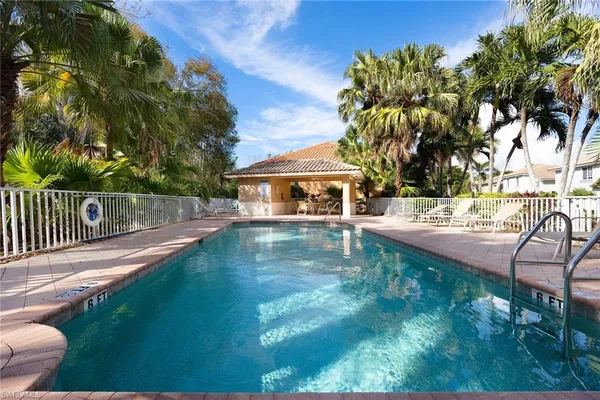 a view of a swimming pool with a patio