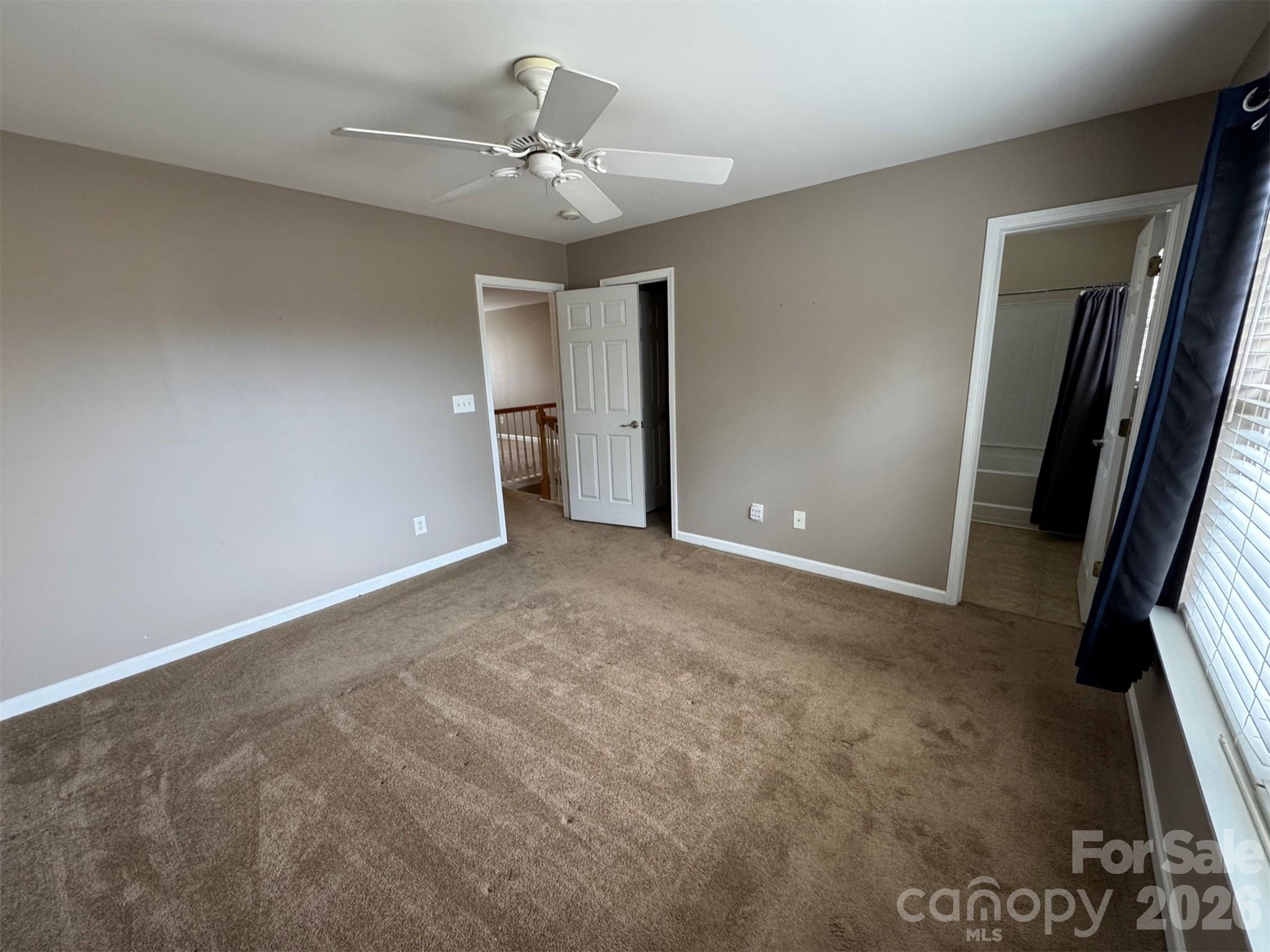 422 Delta Drive Fort Mill, SC 29715 - Photo 11 of 14 en empty room with windows and fan
