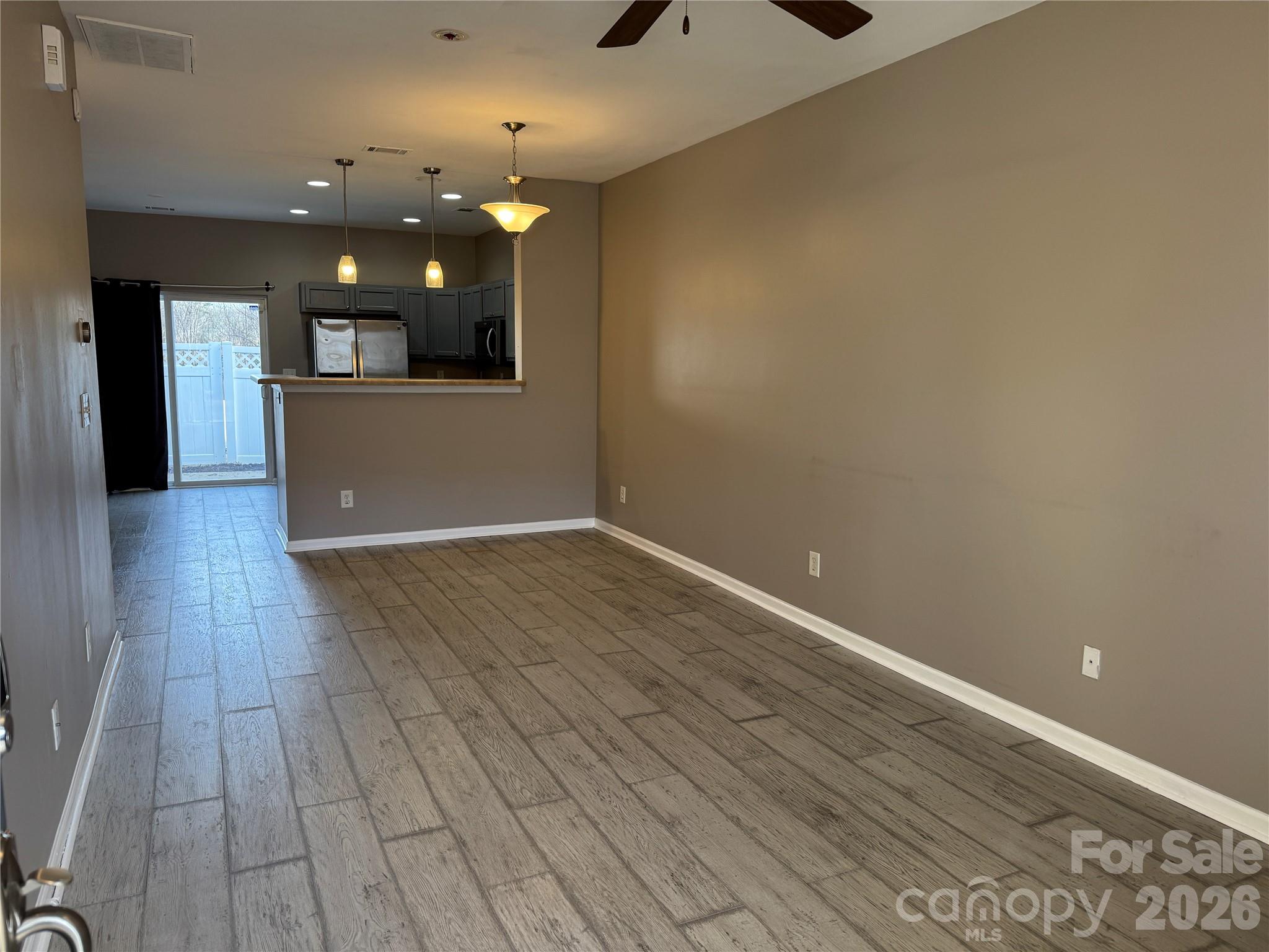 422 Delta Drive Fort Mill, SC 29715 - Photo 5 of 14 an empty room with wooden floor and entrance