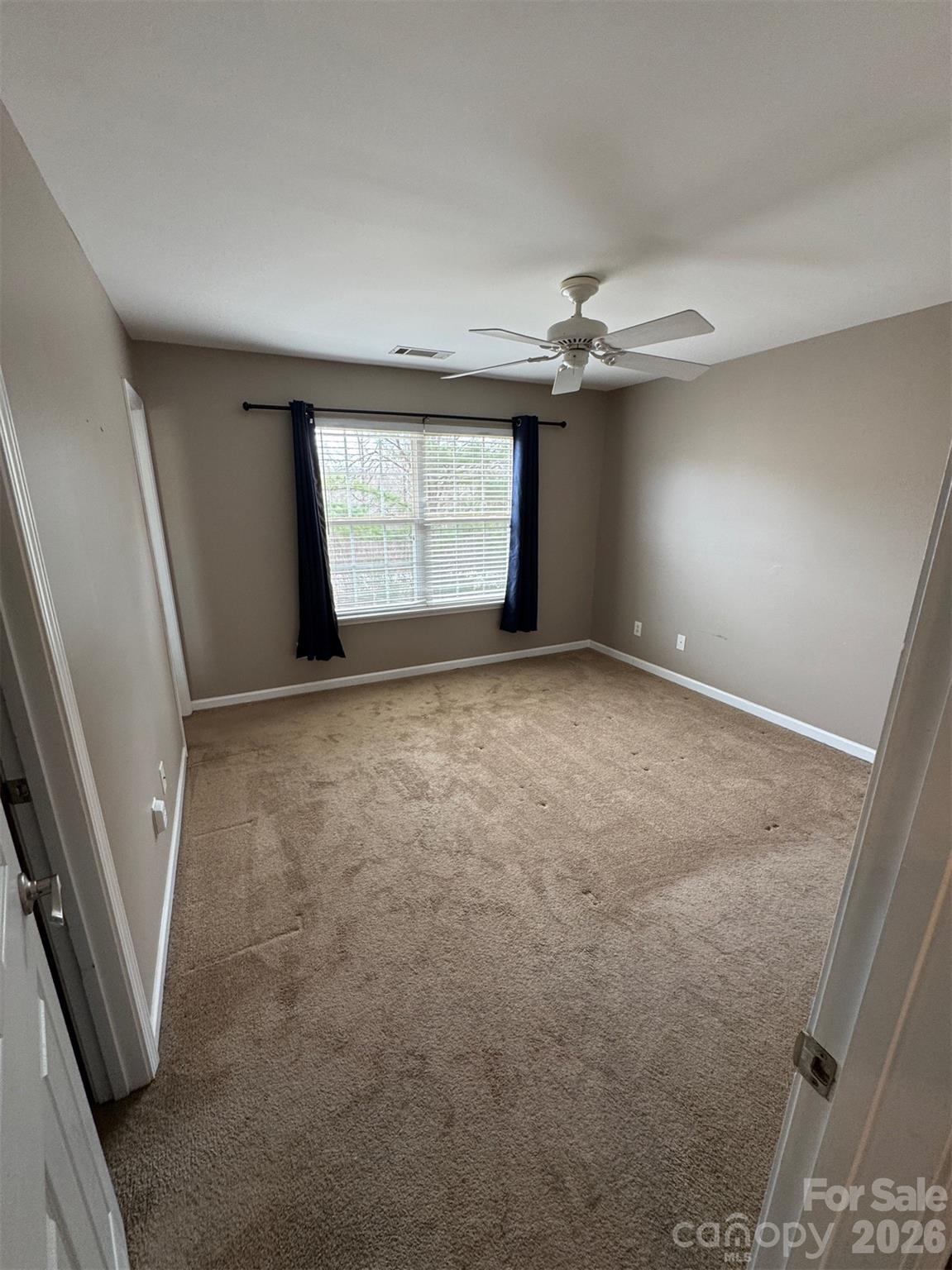 422 Delta Drive Fort Mill, SC 29715 - Photo 10 of 14 an empty room with windows and entrance