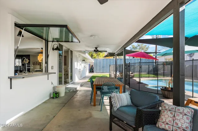 a living room filled with furniture and a chandelier