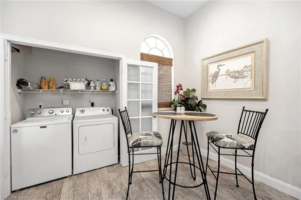 a view of a dining room with furniture and wooden floor