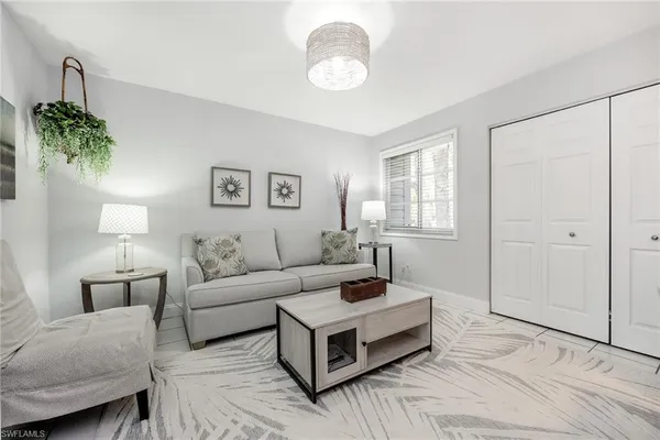 a living room with furniture and a window
