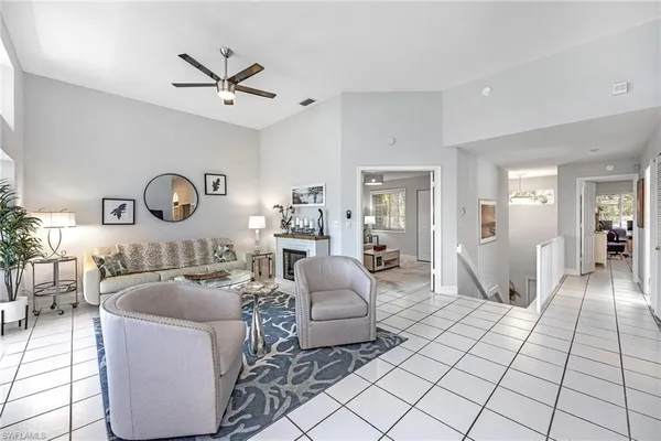 a living room with furniture and a table
