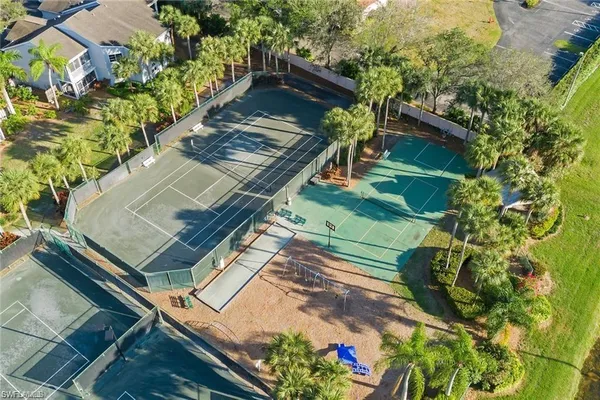 swimming pool view with a seating space