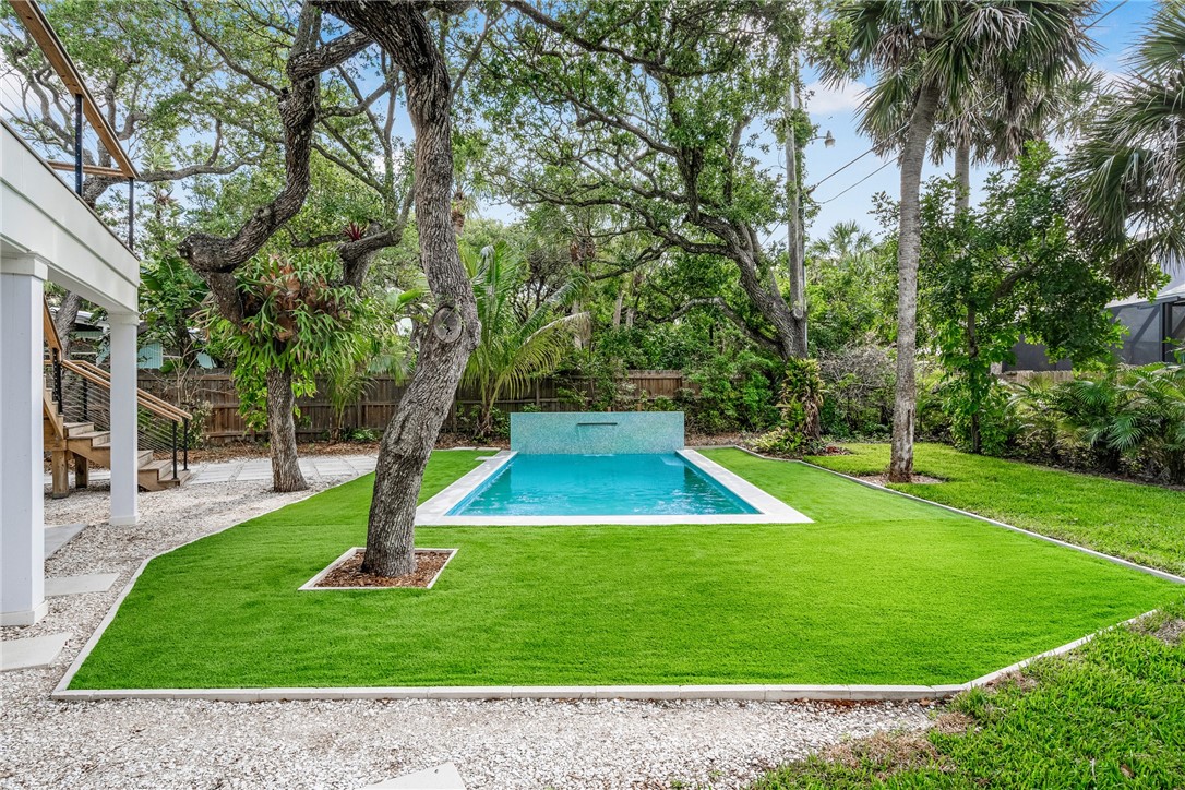 1881 Pebble Path Vero Beach, FL 32963 - Photo 30 of 34 a view of a backyard with a slide