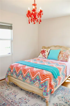 a room with flowers and a wooden floor