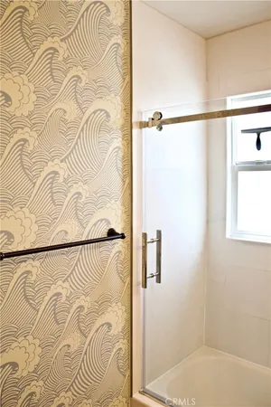 a bathroom with a bathtub and shower