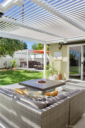 a view of a house with backyard and porch