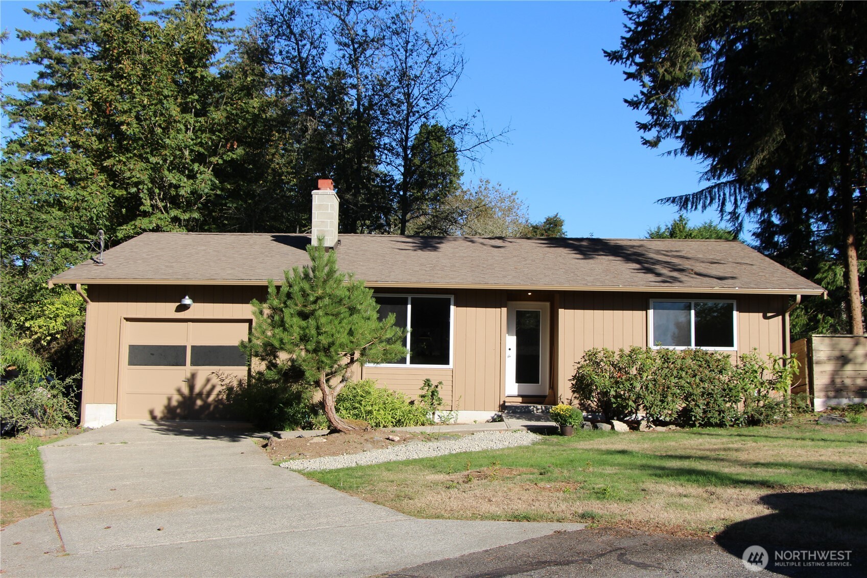 8820 Prentice Avenue Gig Harbor, WA 98332 - Photo 1 of 13 front view of a house with a yard