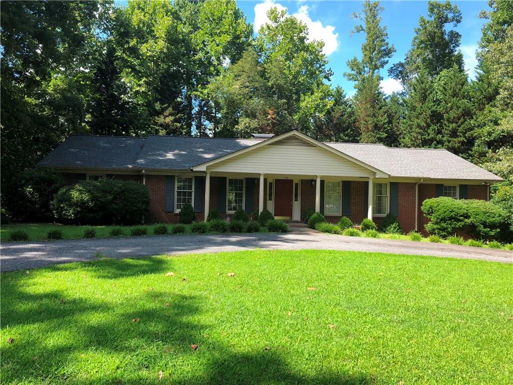 3788 Sandy Ford Road Hickory, NC 28602 - Photo 1 of 30 a front view of a house with a yard porch and furniture