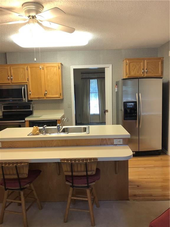 3788 Sandy Ford Road Hickory, NC 28602 - Photo 12 of 30 a view of a kitchen area with furniture and wooden floor