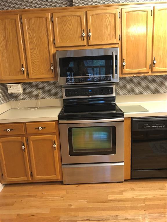 3788 Sandy Ford Road Hickory, NC 28602 - Photo 14 of 30 a stove top oven sitting inside of a kitchen