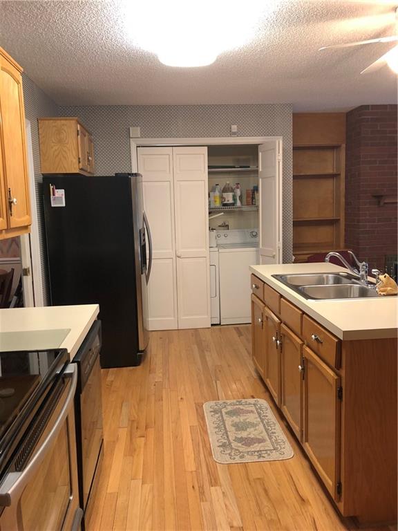 3788 Sandy Ford Road Hickory, NC 28602 - Photo 15 of 30 a kitchen with a sink a refrigerator and a stove