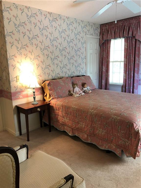 3788 Sandy Ford Road Hickory, NC 28602 - Photo 20 of 30 a bedroom with a bed chair and a window