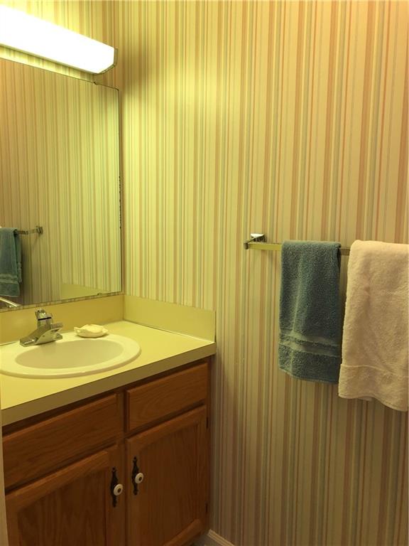 3788 Sandy Ford Road Hickory, NC 28602 - Photo 21 of 30 a bathroom with a granite countertop sink and a mirror