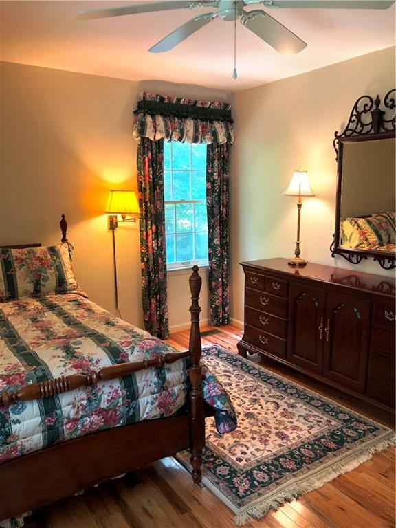 3788 Sandy Ford Road Hickory, NC 28602 - Photo 23 of 30 a bedroom with a bed and wooden floor