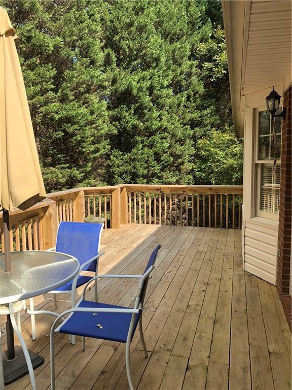 3788 Sandy Ford Road Hickory, NC 28602 - Photo 26 of 30 a view of balcony with wooden floor and outdoor seating
