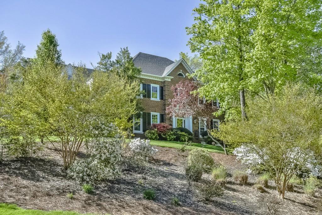 3631 Plantation Road, Unit 15 Charlotte, NC 28270 - Photo 1 of 23 a brick house with trees in front of it
