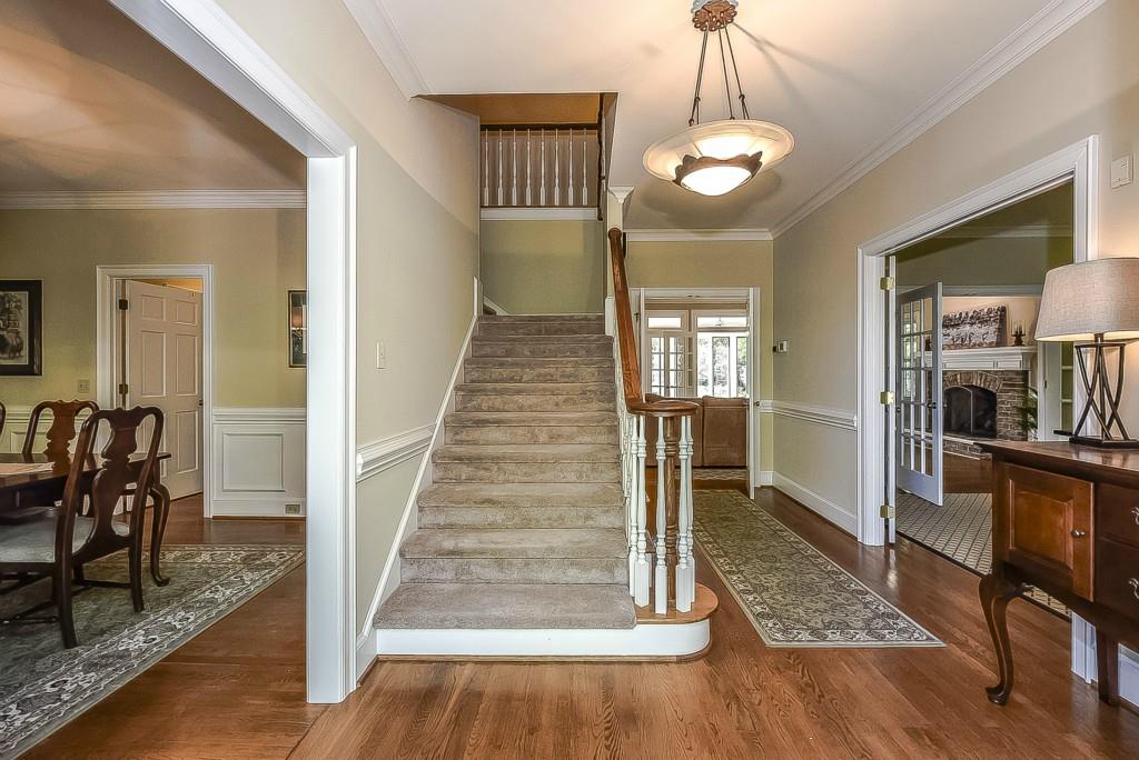 3631 Plantation Road, Unit 15 Charlotte, NC 28270 - Photo 2 of 23 a view of a livingroom kitchen and dinning room with wooden floor