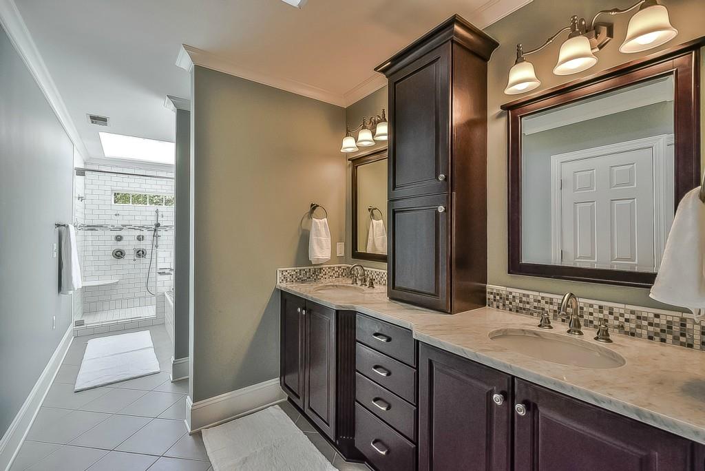 3631 Plantation Road, Unit 15 Charlotte, NC 28270 - Photo 12 of 23 a bathroom with a granite countertop sink and a mirror