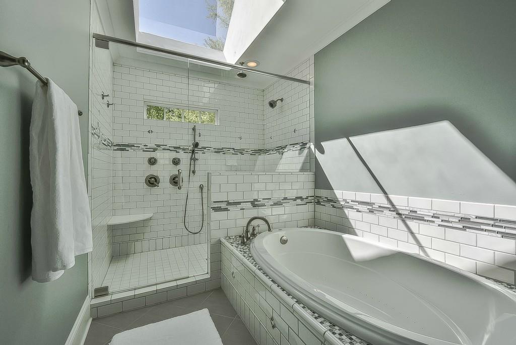 3631 Plantation Road, Unit 15 Charlotte, NC 28270 - Photo 13 of 23 a bathroom with a bathtub and shower