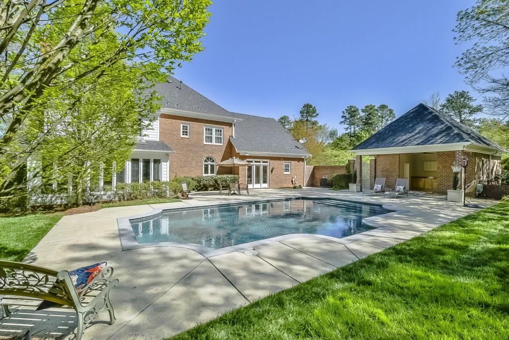 3631 Plantation Road, Unit 15 Charlotte, NC 28270 - Photo 20 of 23 a front view of a house with swimming pool having outdoor seating