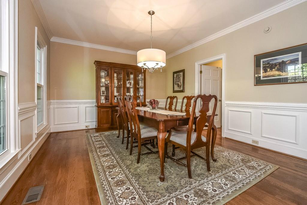 3631 Plantation Road, Unit 15 Charlotte, NC 28270 - Photo 3 of 23 a view of a dining room with furniture window and wooden floor