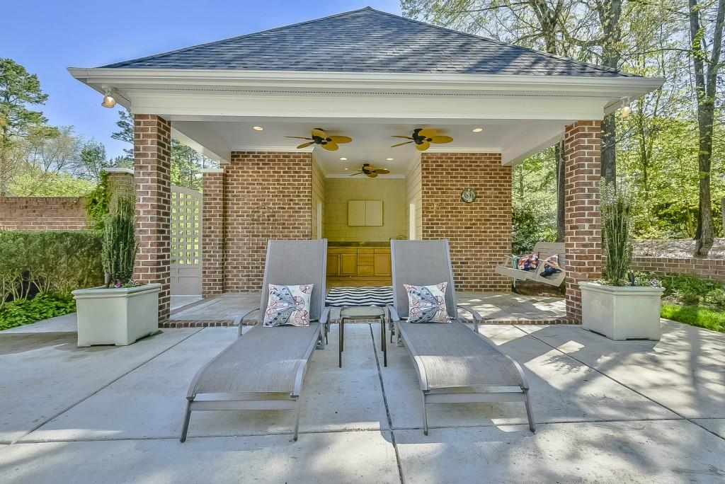 3631 Plantation Road, Unit 15 Charlotte, NC 28270 - Photo 21 of 23 a view of a patio with couches table and chairs and potted plants