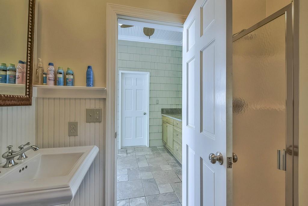 3631 Plantation Road, Unit 15 Charlotte, NC 28270 - Photo 22 of 23 a bathroom with a tub sink and mirror