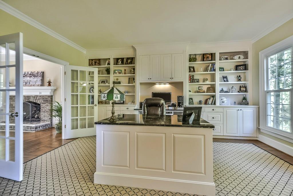 3631 Plantation Road, Unit 15 Charlotte, NC 28270 - Photo 4 of 23 a kitchen with stainless steel appliances a sink and a table