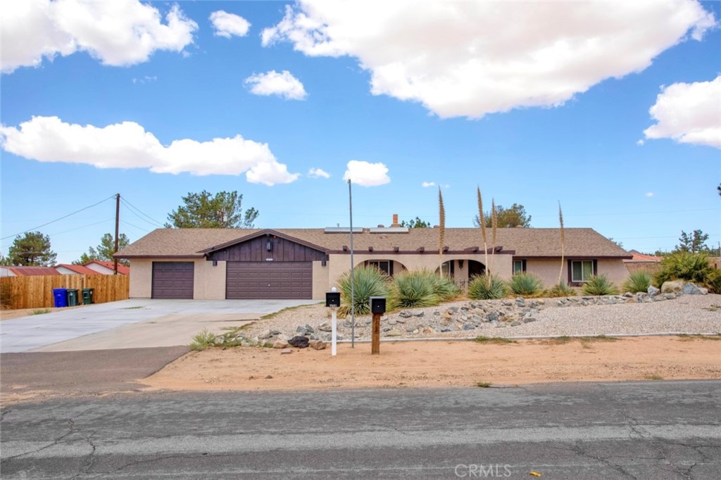 19102 Tehachapi Road Apple Valley, CA 92307 - Photo 1 of 1 a view of a house with a yard and pathway