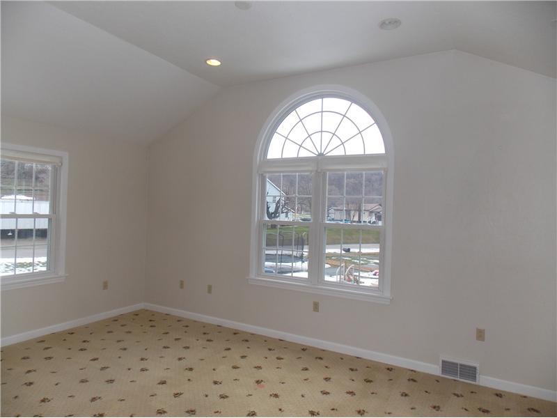 242 Kangaroo Hill Road Lowber, PA 15660 - Photo 11 of 21 Master Bedroom. Vaulted ceilings, recessed lighting, a celestial window, and upgraded carpeting make this master bedroom a wonderful retreat after your busy day...