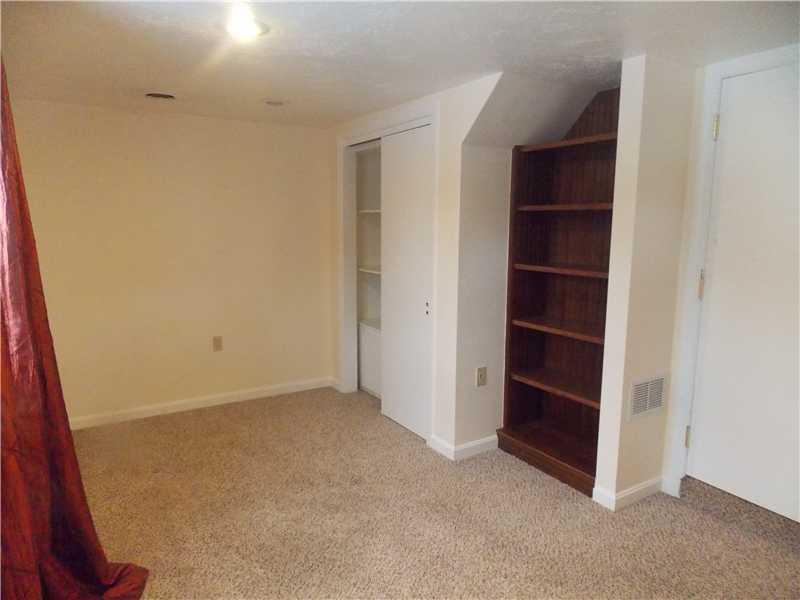 242 Kangaroo Hill Road Lowber, PA 15660 - Photo 19 of 21 Bedroom. The downstairs bedroom also features shelving...very handy...as well as a closet...
